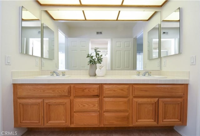 bathroom featuring tile patterned floors and vanity