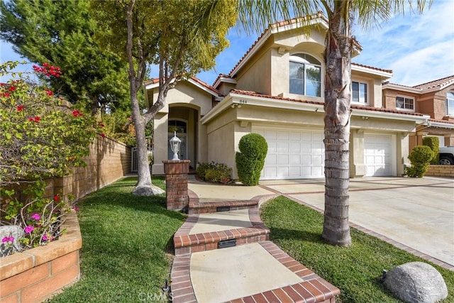 mediterranean / spanish-style home with a garage