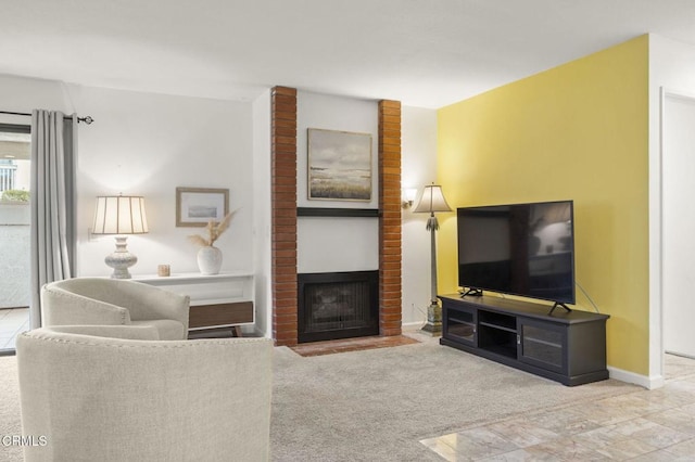 carpeted living room with a brick fireplace