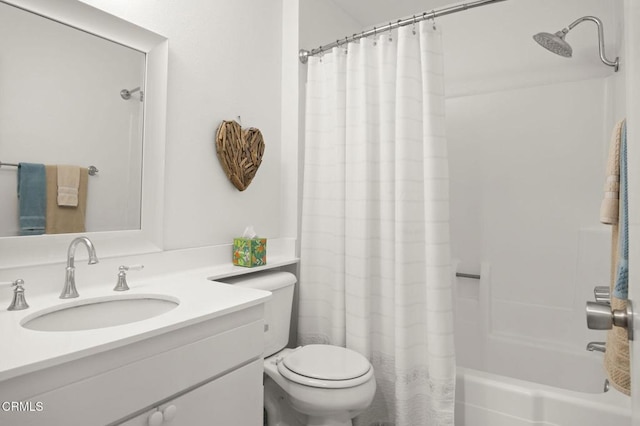 full bathroom featuring vanity, shower / bath combo, and toilet