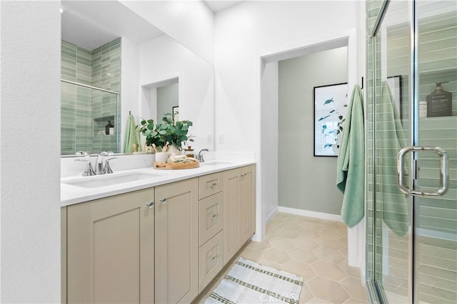 bathroom with tile patterned flooring, vanity, and a shower with shower door