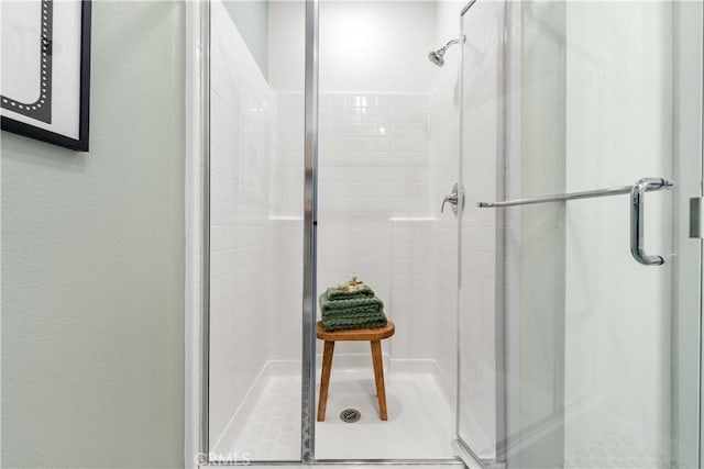 bathroom featuring an enclosed shower