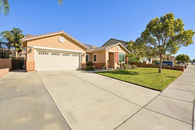 ranch-style home with a garage and a front yard