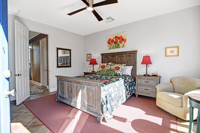 tiled bedroom featuring ceiling fan