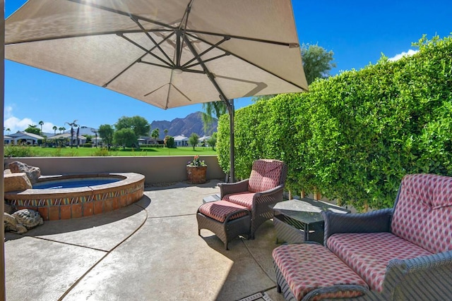 view of patio / terrace with a mountain view