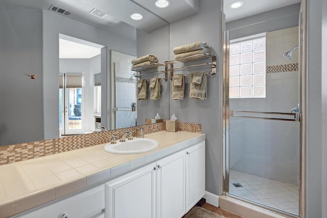 bathroom with vanity, tile patterned floors, and an enclosed shower