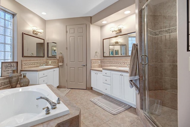 bathroom featuring tile patterned floors, vanity, and separate shower and tub