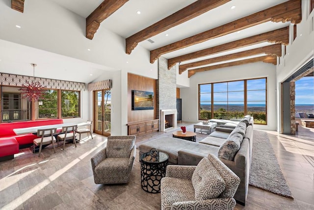 living room with beamed ceiling and a fireplace