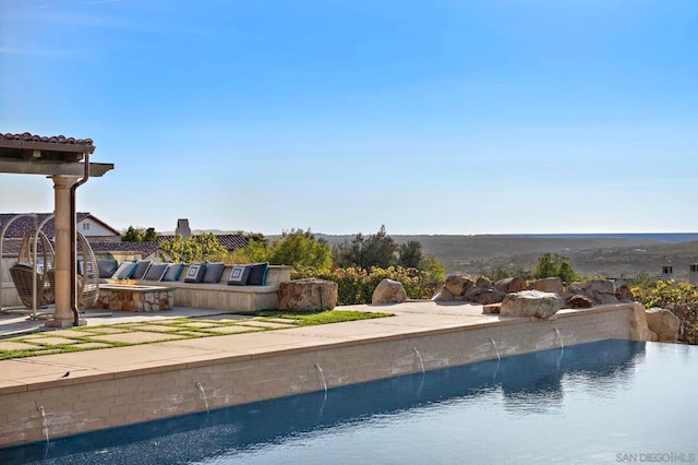 view of pool with pool water feature