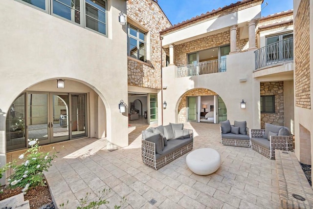 view of patio with outdoor lounge area and french doors