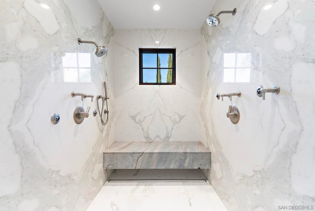 bathroom with a tile shower