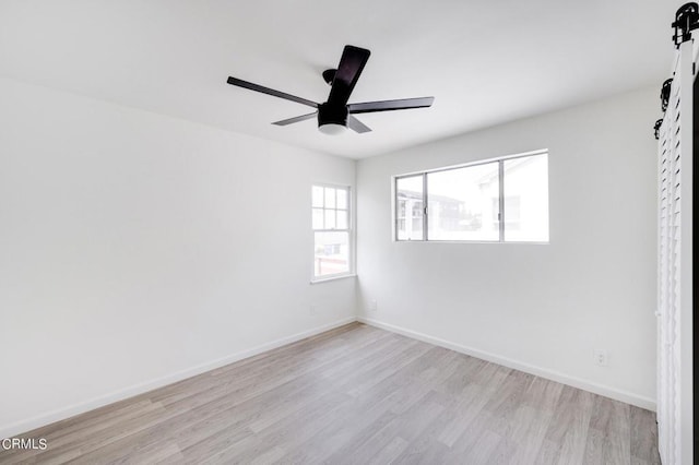 spare room with light hardwood / wood-style flooring and ceiling fan