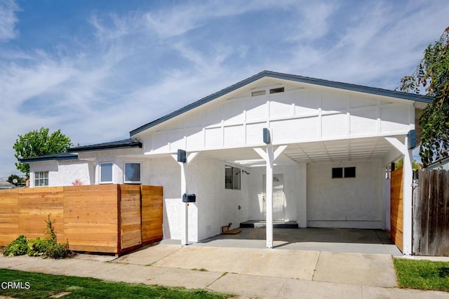 exterior space with a carport