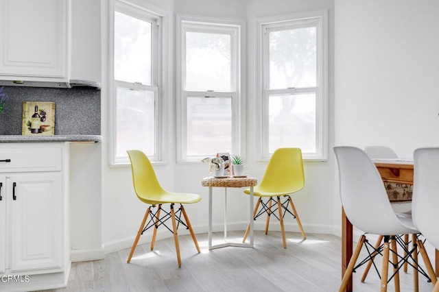 dining area featuring light wood-type flooring