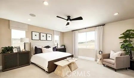 carpeted bedroom featuring ceiling fan