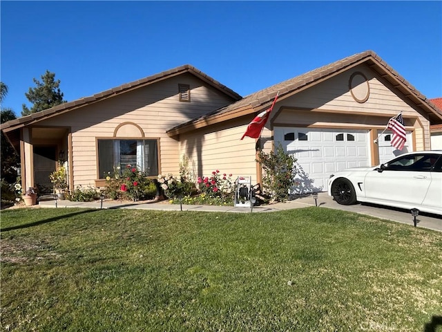 single story home with a garage and a front lawn