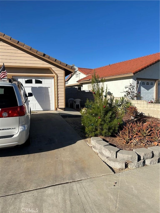 view of side of property with a garage