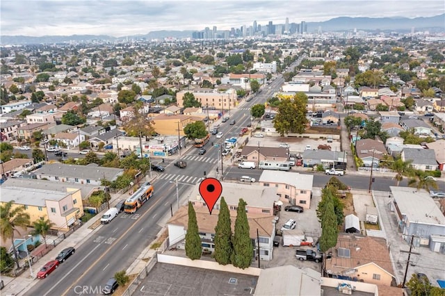 birds eye view of property with a mountain view