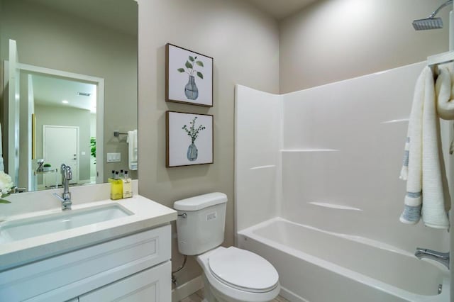 full bathroom with vanity, shower / bath combination, and toilet