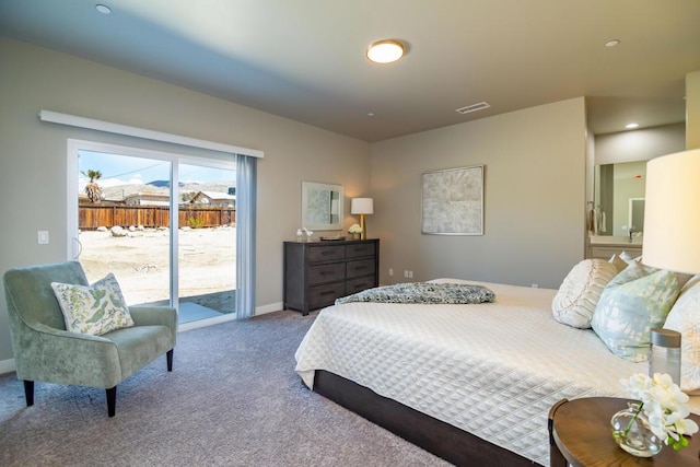 carpeted bedroom featuring access to exterior