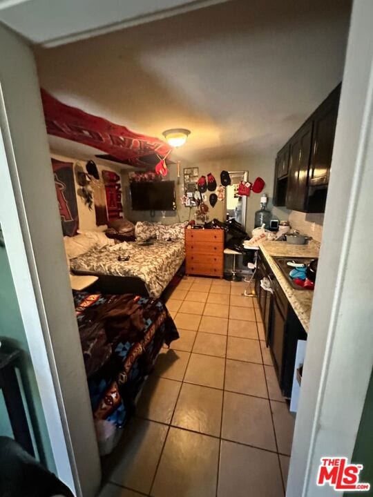 kitchen with light tile patterned flooring