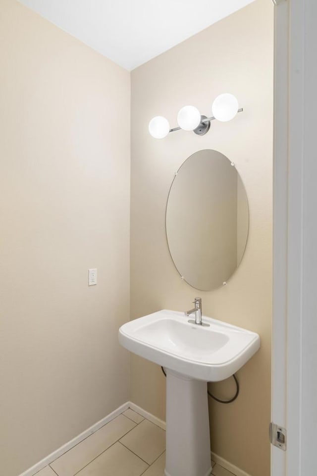 bathroom with tile patterned flooring and sink