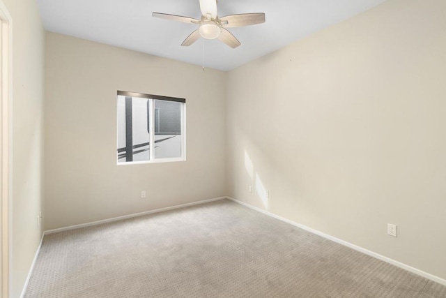 empty room with light carpet and ceiling fan