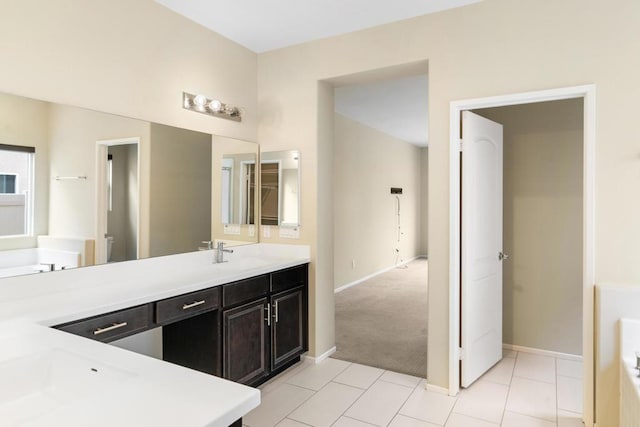 bathroom featuring tile patterned flooring and vanity