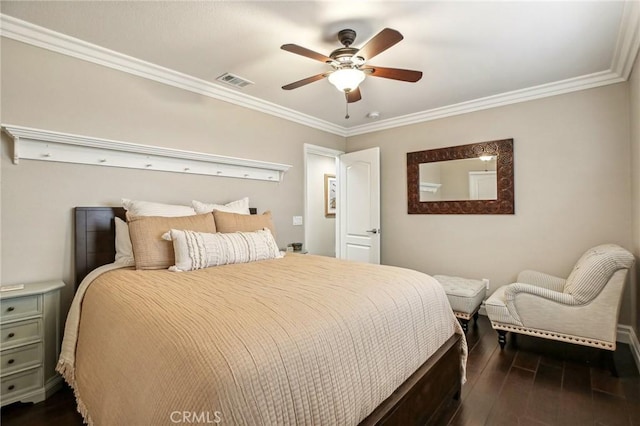 bedroom featuring ceiling fan, dark hardwood / wood-style flooring, and ornamental molding