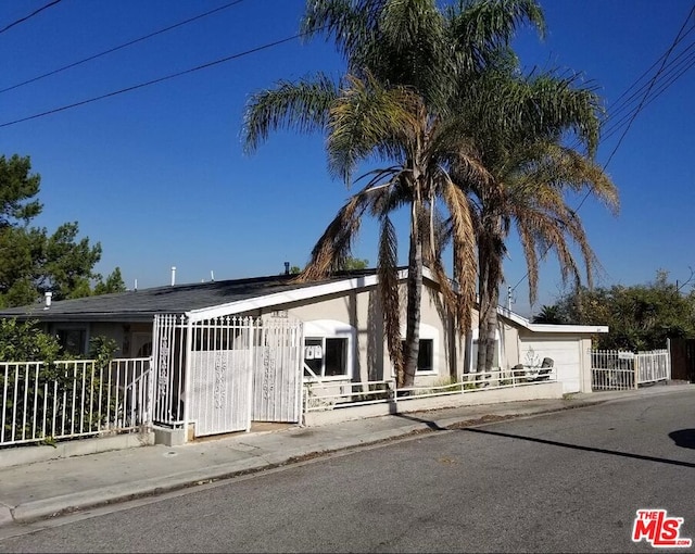 view of front of property featuring a garage