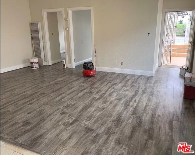 unfurnished room with hardwood / wood-style floors