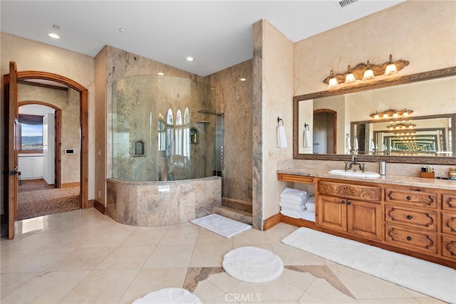 bathroom featuring vanity, tile patterned floors, and independent shower and bath