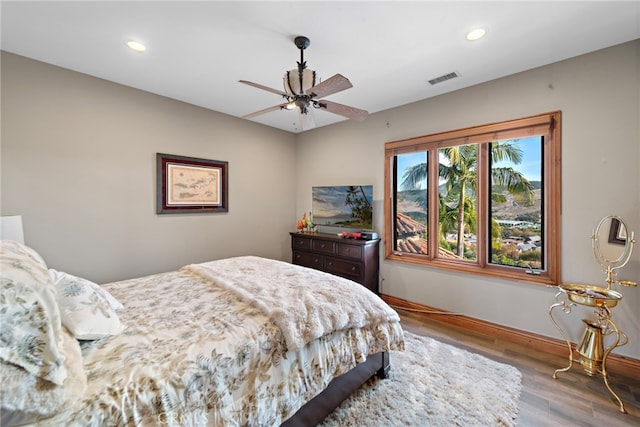 bedroom featuring hardwood / wood-style floors and ceiling fan