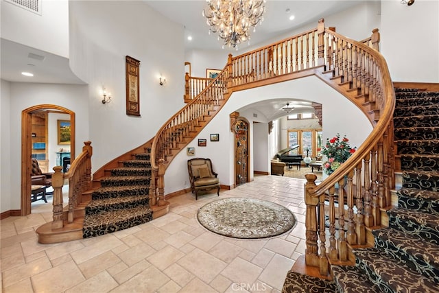 entryway with a chandelier and a high ceiling