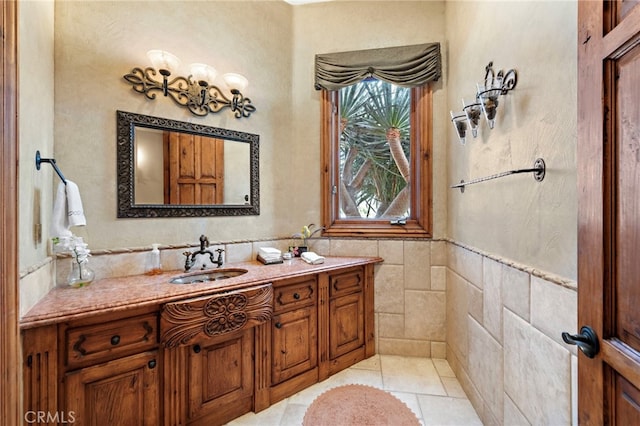 bathroom featuring tile patterned floors, vanity, and tile walls