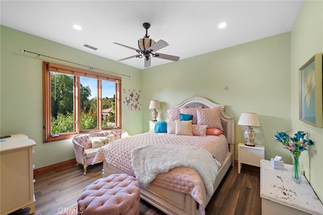 bedroom with ceiling fan and dark hardwood / wood-style floors