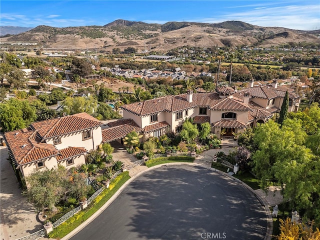 birds eye view of property featuring a mountain view