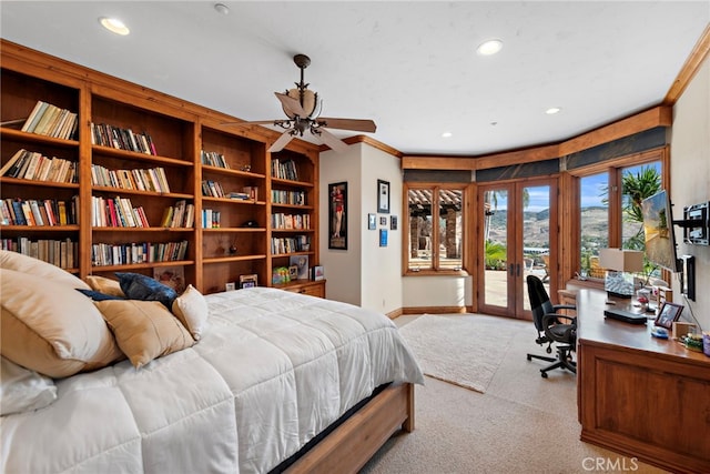 bedroom featuring access to exterior, french doors, light colored carpet, ceiling fan, and crown molding