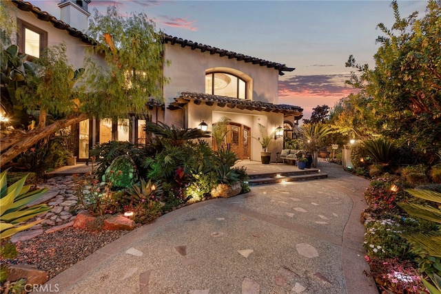 mediterranean / spanish-style home featuring a garage