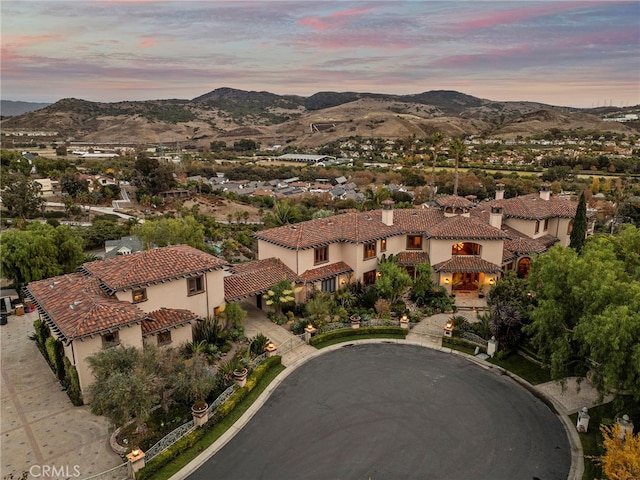 aerial view at dusk with a mountain view