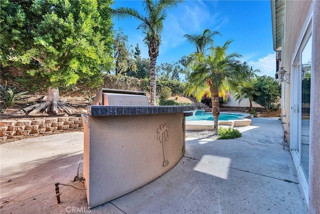 view of patio with an outdoor kitchen