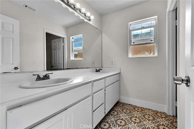 bathroom featuring tile patterned flooring and vanity