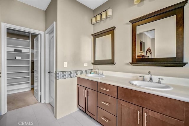 bathroom with tile patterned flooring and vanity