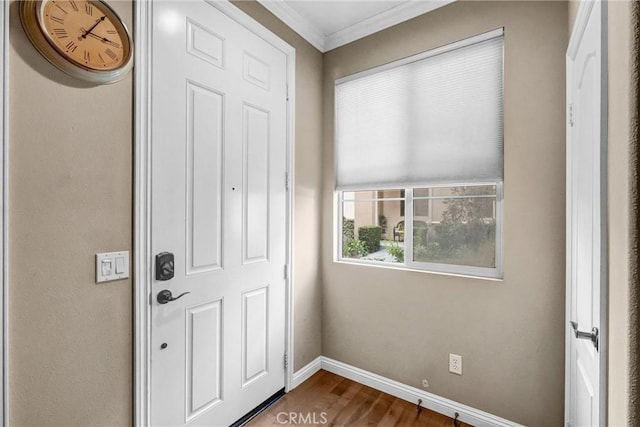 doorway featuring wood-type flooring and ornamental molding