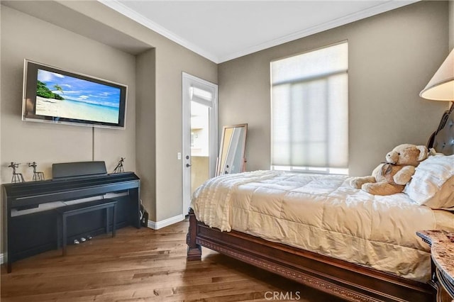 bedroom featuring crown molding and hardwood / wood-style flooring