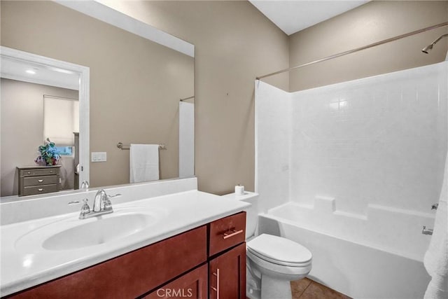 full bathroom featuring tile patterned floors, toilet, vanity, and tub / shower combination