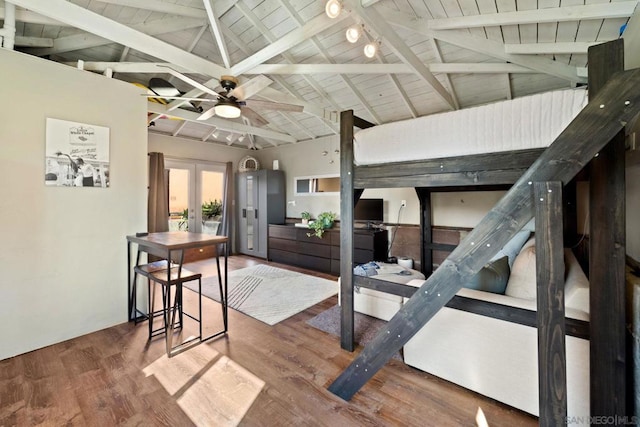 interior space featuring hardwood / wood-style flooring, beam ceiling, and french doors