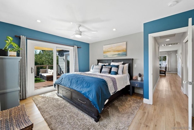 bedroom with access to exterior, light hardwood / wood-style flooring, multiple windows, and ceiling fan