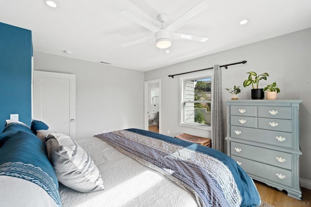 bedroom with ceiling fan and dark hardwood / wood-style floors