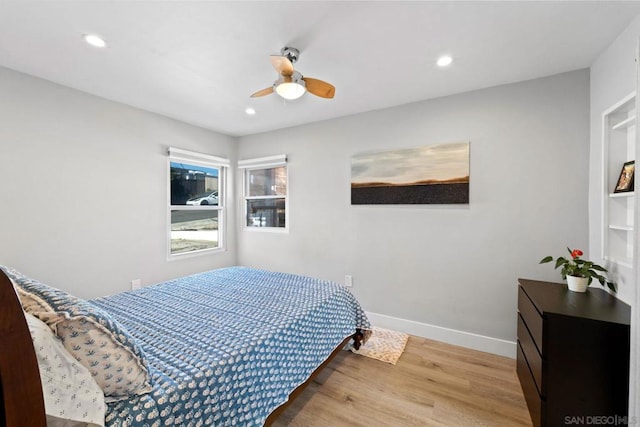 bedroom featuring ceiling fan and light hardwood / wood-style floors